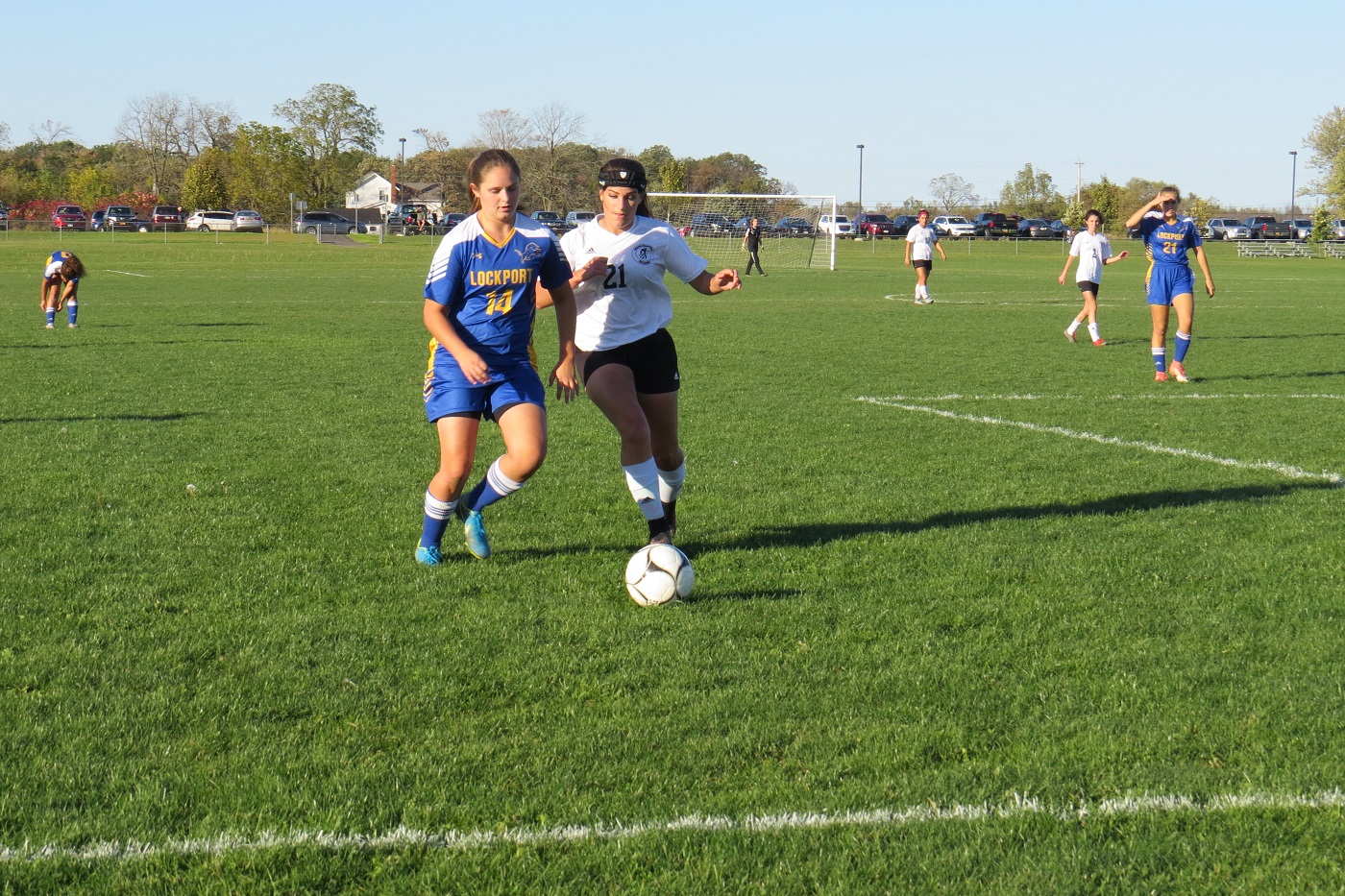Michelle Terbot of Niagara-Wheatfield battles Rebecca Schrader of Lockport for possession of the ball.