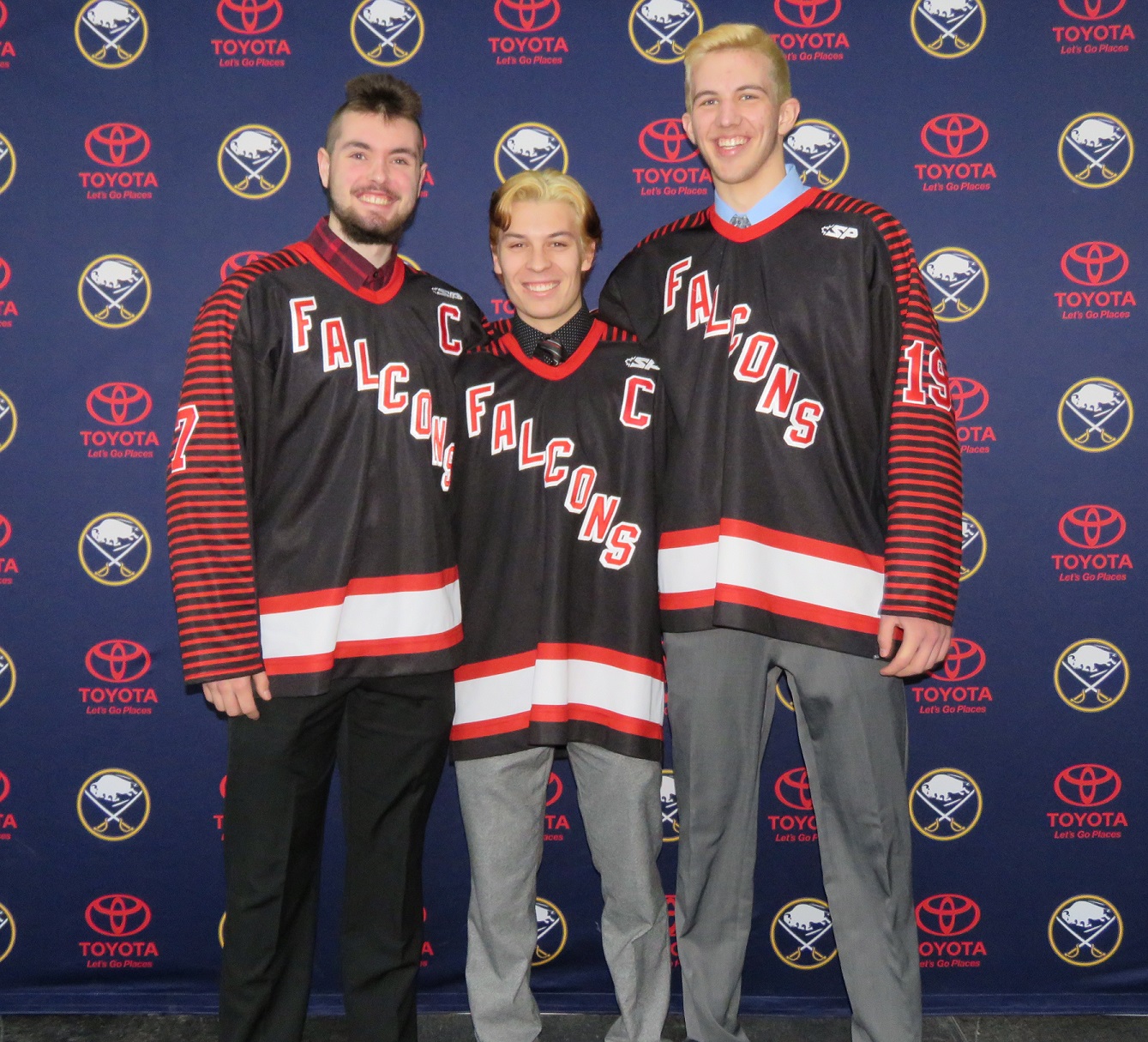 From left to right: Chris Tobey, Nick Peters and Zack Belter pose for a picture during Friday morning's Section VI hockey press conference. The three have played for the Niagara-Wheatfield Falcons hockey team since they were freshman. (Photo by David Yarger)