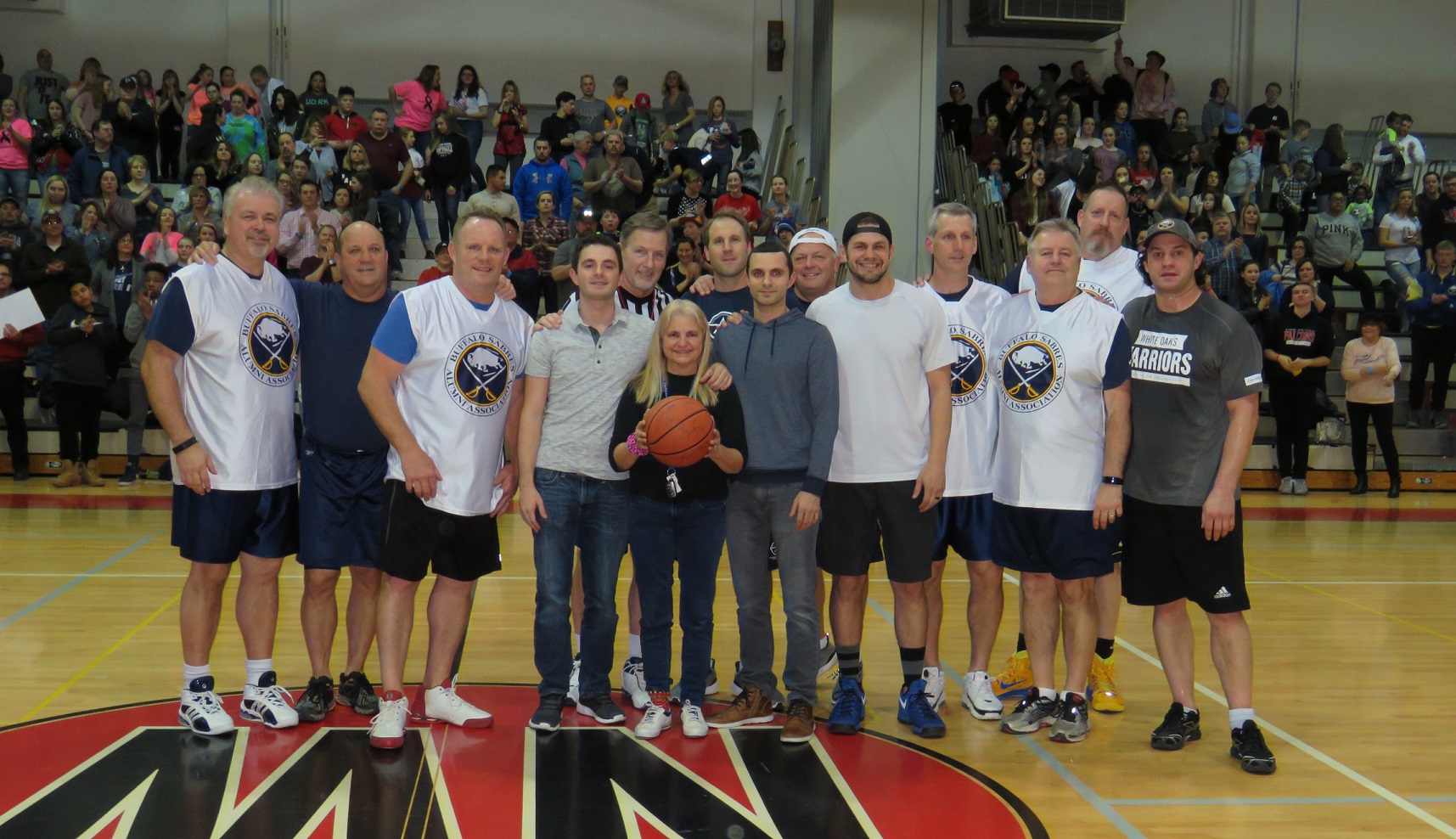 Family of the late James Campbell pose for a picture with the Sabres Alumni. (All photos by David Yarger)
