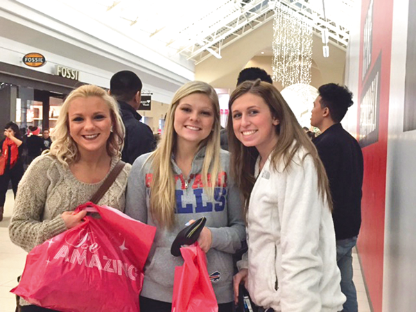 Pictured, from left, Meghan Petracca, Jordan Behringer and Bailey Behringer were some of the shoppers waiting in line getting ready for stores to open Thanksgiving night. (photo by Hayley Evans)