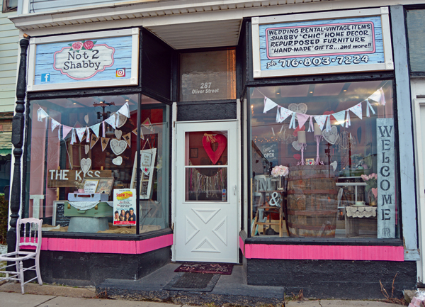 Shown is Not2Shabby's storefront on Oliver Street. Owner Laurie Essenburg showcases some of her shabby-chic inspired wedding rentals.