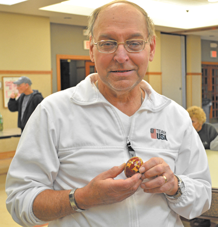 Mike Parsnick holds one of the psyanka eggs he decorated.