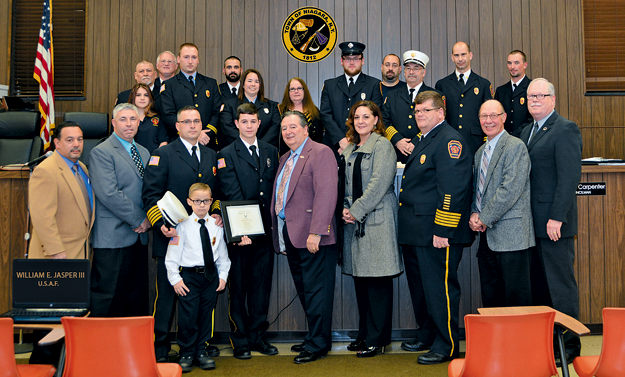 William E. Jasper III (center) was recognized for his enlistment into the U.S. Air Force at Tuesday's Town of Niagara board meeting. (Click for a larger image)