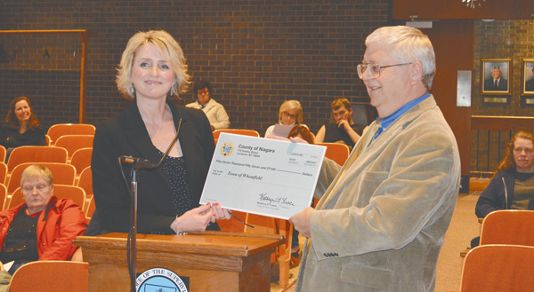 Niagara County Legislator Kathryn Lance presents a check for casino revenue to Supervisor Bob Cliffe.