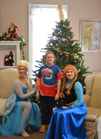 Posing for a photo with Disney's "Frozen" stars Anna and Elsa.