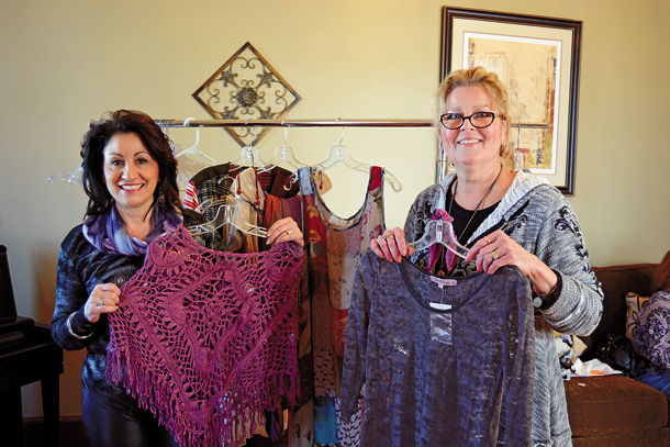 Angela R. Johnson-Renda, (left) executive director of the Chamber of Commerce of the Tonawandas, and Holly Rankie, owner of Hip Gypsy at 78 Webster St., pose for a photo while preparing for Hip Gipsy's fashion show. (Photo by Lauren Zaepfel)