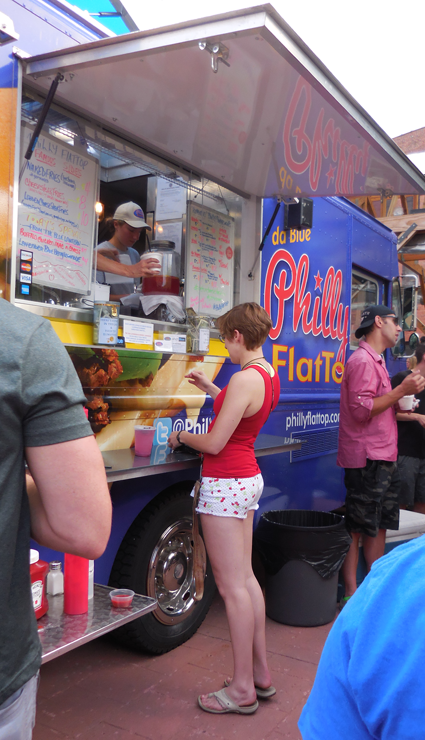 A look at the front of the line of Philly Flattop food truck. A look at the front of the line of Philly Flattop food truck.