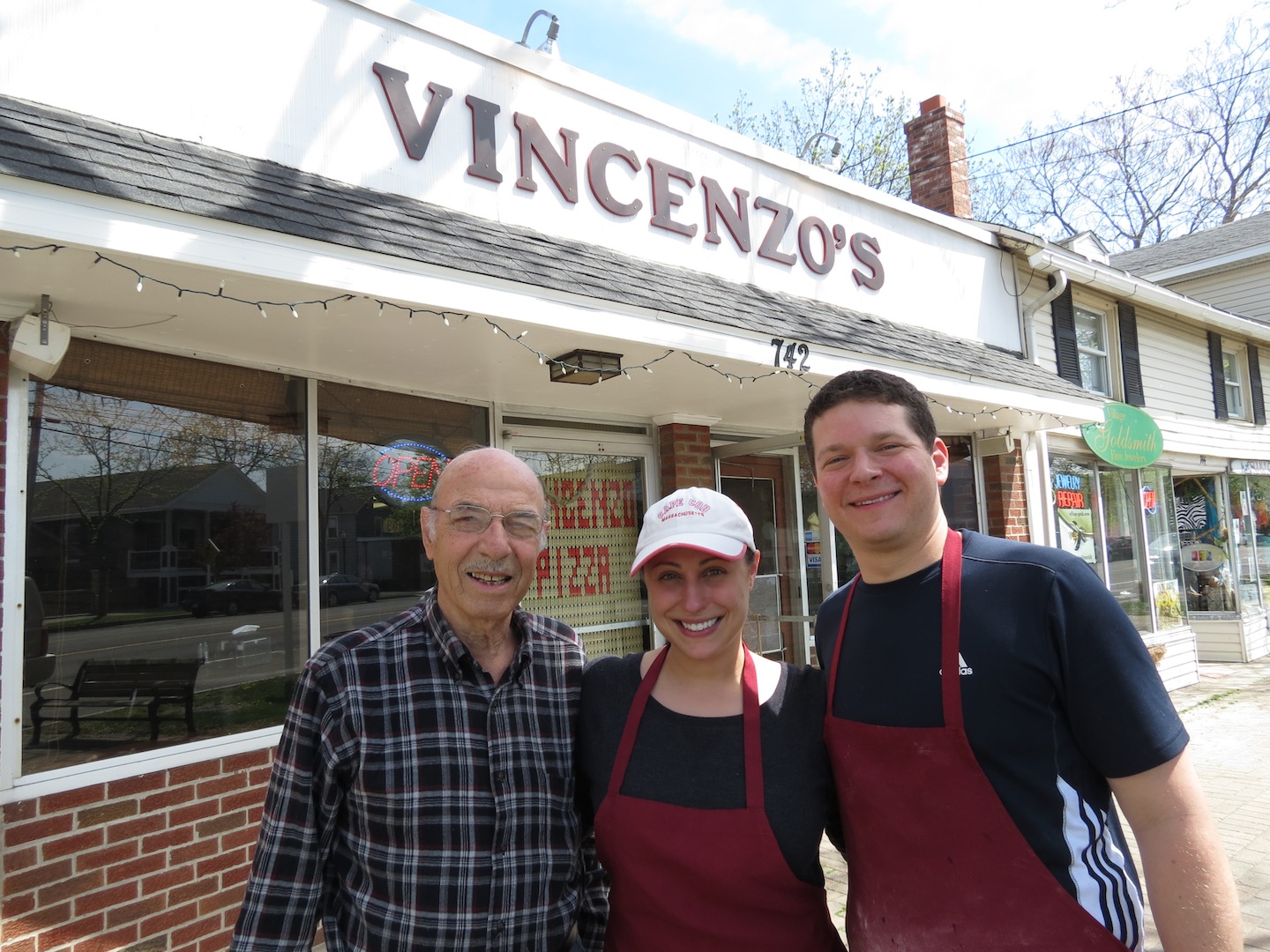 Pictured from left, Vincent Morreale, Sarina and David Munzi stand outside of Vincenzo's Pizza House, at 742 Center St.