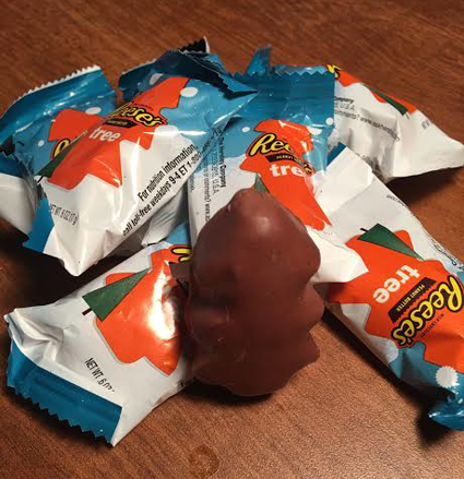 Reese's Peanut Butter Cups are in the shape of Christmas trees to represent the holiday season.