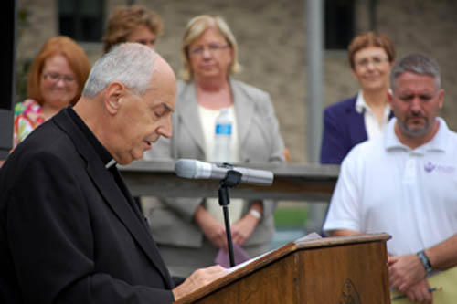 The Rev. Joseph L. Levesque, Niagara University president, speaks during the grand opening and blessing of the Institute for Civic Engagement.