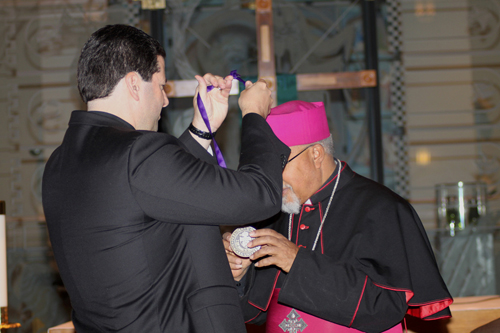 The Most Rev. Abune Berhaneyesus D. Souraphiel, C.M., archbishop of Ethiopia, receives the President's Medal from Niagara University President the Rev. James J. Maher, C.M.