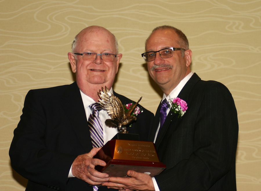 James Glynn, '57, owner of the Maid of the Most Corp., receives the award for Family Business of the Year from Dr. Shawn Daly, dean of NU's College of Business Administration.