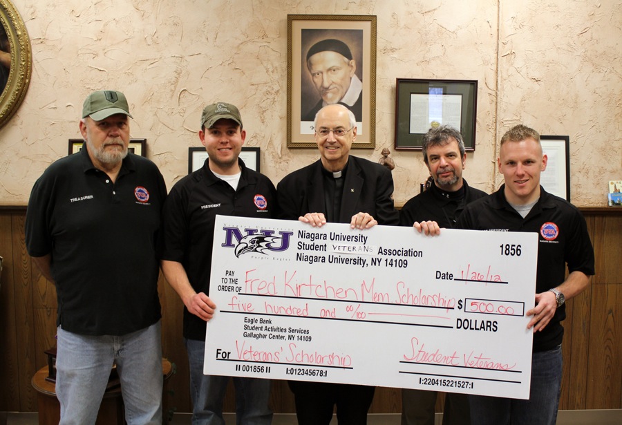 Members of Niagara University's student veterans' organization present a check to the Rev. Joseph L. Levesque, C.M., NU president, in support of the Sergeant Major Fred E. Kirtchen Memorial Scholarship Fund. Pictured from left is Edward Jackson, SVO treasurer; Andrew Rodems, president; Levesque; Bud Redding, SVO member and volunteer advisor; and Jeffery Laughlin, vice president.