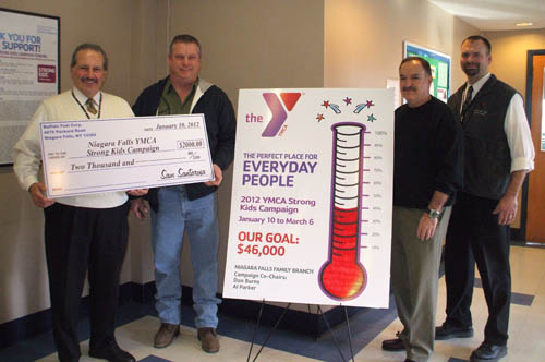Buffalo Fuel Corporation donated $2,000 to the Niagara Falls branch of the YMCA Buffalo Niagara for the 2012 `Strong Kids Campaign.` Pictured from left are: Angelo Tecchio, YMCA associate executive director; Joe Meyers of Buffalo Fuel Corporation; Jerry Talarico of Buffalo Fuel Corporation; and Greg Larson, YMCA executive director. 