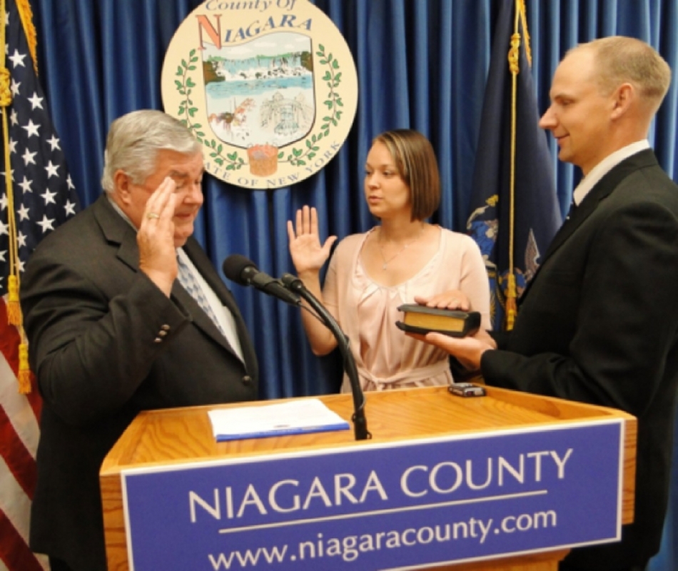 New Niagara County Legislator Cheree J. Copelin, R-LaSalle, is sworn in by Niagara County Clerk Wayne F. Jagow Tuesday in Lockport, while her husband, Luke, holds the Bible. Copelin, who is filling the remainder of former Legislator Vincent M. Sandonato's term, immediately was seated as a legislator. Sandonato's resignation from the Legislature became official Monday, although a local law initially introduced by the former lawmaker to curb protests at funerals advanced in the Legislature Tuesday.