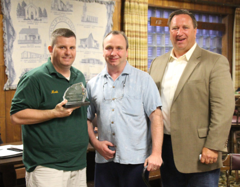 It was a special night at the Bergholz firehall Tuesday as First Assistant Chief Mark Stevens received the 100 Club of Buffalo Hero Award for his involvement in the rescue of a Wheatfield bicyclist struck by a car last June. From left are Mark Stevens, Curtis Senf and Frank E. Broderick, executive director of the 100 Club of Buffalo.