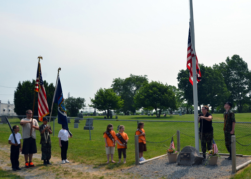 Pictured performing the flag ceremony at last year's Town of Niagara Lions Memorial Day ceremony are the Corps of Cadets and Brownie Scouts.
